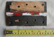 One of many old hinges found on site