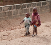 INFANTS GOING TO SCHOOL, GAMBIA by John Dutton